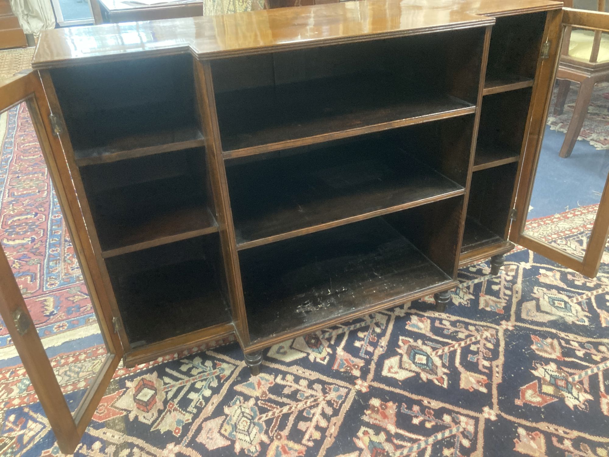A Regency style mahogany and satinwood dwarf breakfront bookcase, length 112cm, depth 42cm, height 78cm